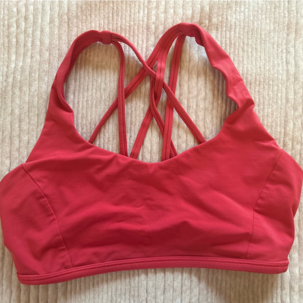 Size 8 lululemon bra in pinky/orange. Good condition.